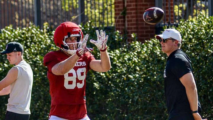 Oklahoma tight end Hayden Hansen prepares to catch a pass during practice. Oklahoma tight end Hayden Hansen prepares to catch a pass during practice.