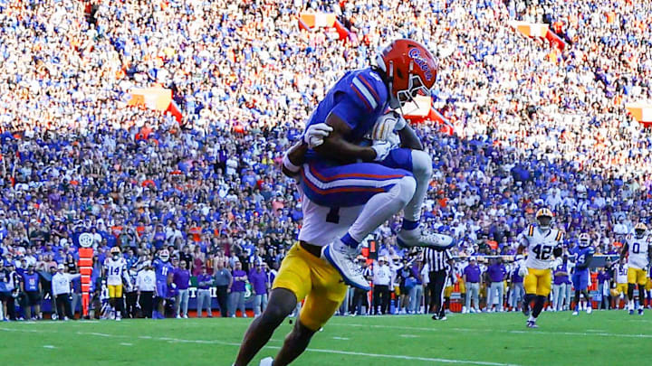 Nov 16, 2024; Gainesville, Florida, USA; Florida Gators wide receiver Elijhah Badger (6) catches the ball for a touchdown over LSU Tigers cornerback Ashton Stamps (1) during the first half at Ben Hill Griffin Stadium. Mandatory Credit: Kim Klement Neitzel-Imagn Images