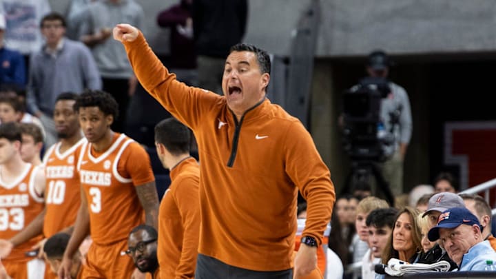Texas Longhorns head coach Sean Miller talks with his team as Auburn Tigers take on Texas Longhorns at Neville Arena in Auburn, Ala. on Wednesday, Jan. 28, 2026. Texas Longhorns leads Auburn Tigers 42-34.