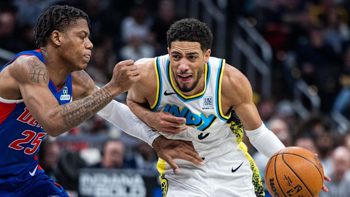 Jan 29, 2025; Indianapolis, Indiana, USA; Indiana Pacers guard Tyrese Haliburton (0) dribbles the ball while Detroit Pistons guard Marcus Sasser (25) defends in the first half at Gainbridge Fieldhouse. Mandatory Credit: Trevor Ruszkowski-Imagn Images