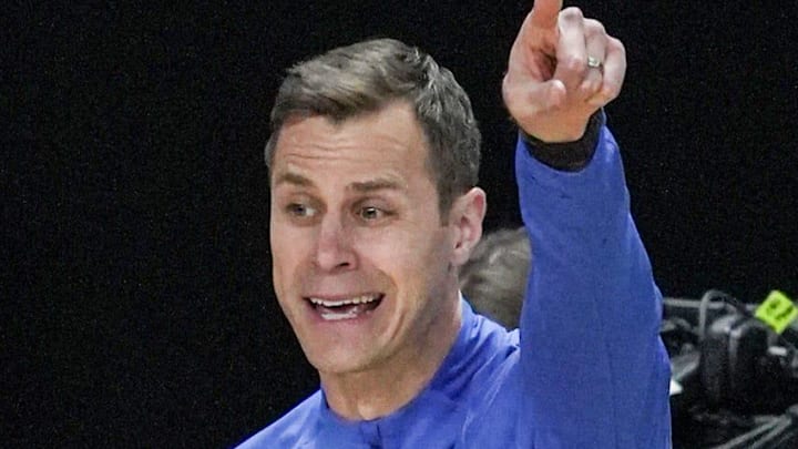 TCU Horned Frogs guard Brock Harding (2) passes near Duke Blue Devils head coach Jon Scheyer March 21, 2026 during the NCAA Men’s Basketball Tournament second round East Region game at the Bon Secours Wellness Arena in Greenville, South Carolina.