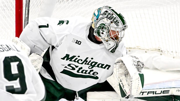 Michigan State's Trey Augustine, center, stops the puck after a Michigan shot during the first period on Friday, Dec. 5, 2025, at Munn Ice Arena in East Lansing. Michigan State's Trey Augustine, center, stops the puck after a Michigan shot during the first period on Friday, Dec. 5, 2025, at Munn Ice Arena in East Lansing.