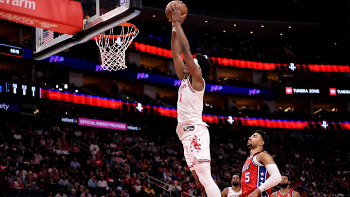 Apr 9, 2026; Houston, Texas, USA; Houston Rockets guard Amen Thompson (1) dunks the ball against Philadelphia 76ers guard Quentin Grimes (5) during the first quarter at Toyota Center. Mandatory Credit: Erik Williams-Imagn Images
