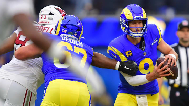 Jan 4, 2026; Inglewood, California, USA;  Los Angeles Rams quarterback Matthew Stafford (9) is pressured by. Arizona Cardinals defensive tackle Calais Campbell (93) during the first half at SoFi Stadium. Mandatory Credit: Gary A. Vasquez-Imagn Images
