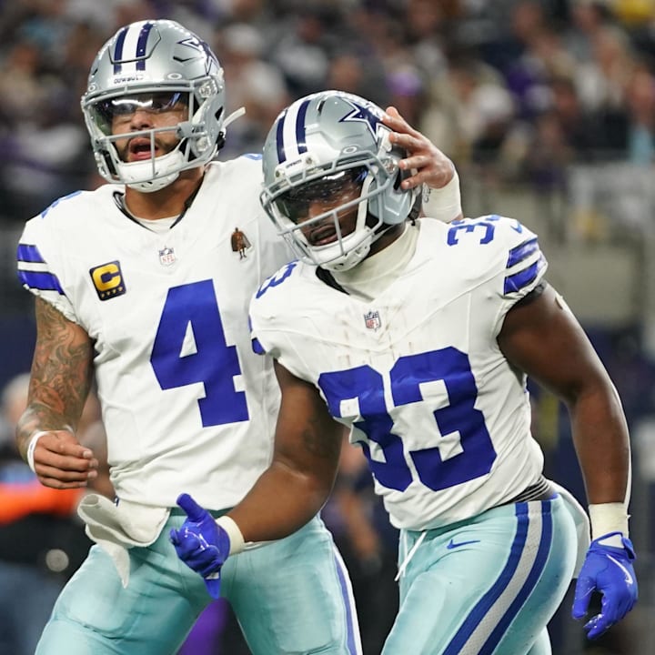 Dallas Cowboys running back Javonte Williams celebrates with Dak Prescott after a touchdown against the Minnesota Vikings a