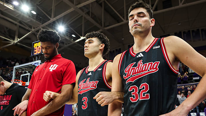 Indiana's Trey Galloway (right), Anthony Leal (middle) and Dallas James (left) during the national anthem at Alaska Airlines Arena.