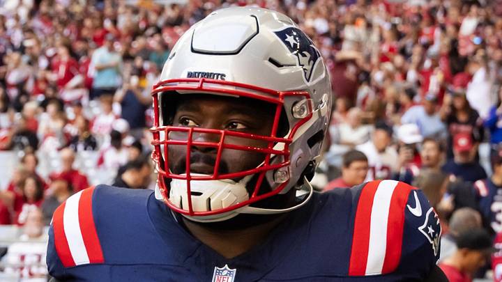 Dec 15, 2024; Glendale, Arizona, USA; New England Patriots offensive tackle Mike Onwenu (71) against the Arizona Cardinals at State Farm Stadium. Mandatory Credit: Mark J. Rebilas-Imagn Images