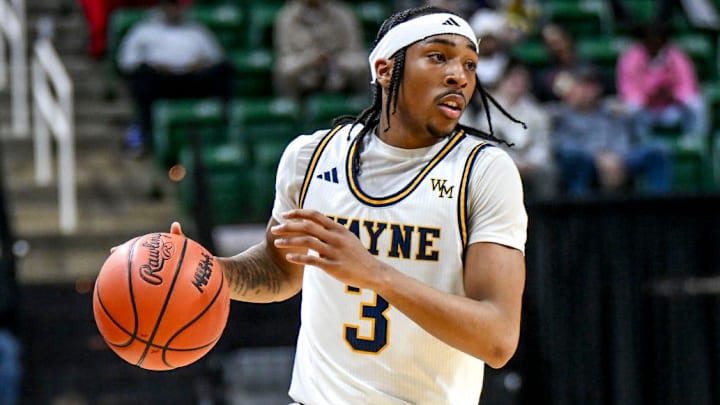 Wayne Memorial's Carlos Medlock Jr. moves the ball against Flint Carman-Ainsworth during the second quarter in the Division 1 state semifinal on Friday, March 14, 2025, at the Breslin Center in East Lansing. Wayne Memorial's Carlos Medlock Jr. moves the ball against Flint Carman-Ainsworth during the second quarter in the Division 1 state semifinal on Friday, March 14, 2025, at the Breslin Center in East Lansing.
