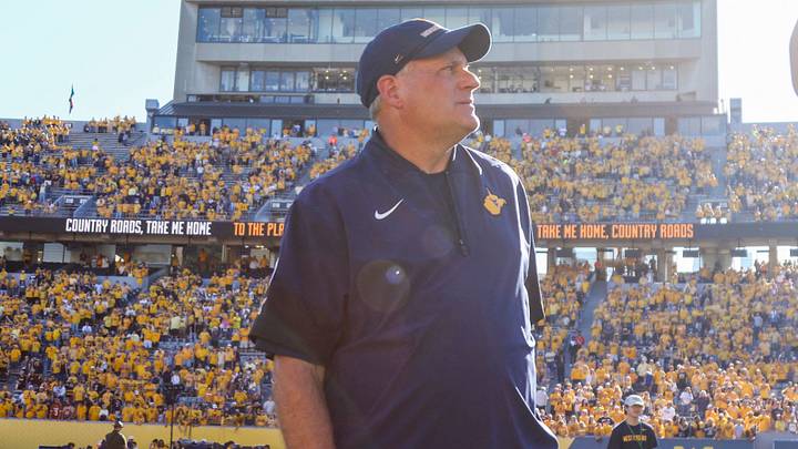 Aug 30, 2025; Morgantown, West Virginia, USA; West Virginia Mountaineers head coach Rich Rodriguez sings “Country Roads” after defeating the Robert Morris Colonials at Milan Puskar Stadium. Mandatory Credit: Ben Queen-Imagn Images Aug 30, 2025; Morgantown, West Virginia, USA; West Virginia Mountaineers head coach Rich Rodriguez sings “Country Roads” after defeating the Robert Morris Colonials at Milan Puskar Stadium. Mandatory Credit: Ben Queen-Imagn Images