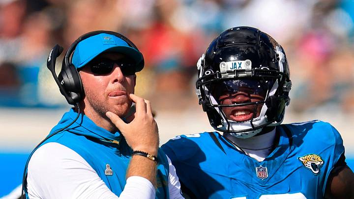 Jacksonville Jaguars head coach Liam Coen looks to the video scoreboard with wide receiver Travis Hunter (12) during the fourth quarter of an NFL football matchup, Sunday, Oct. 12, 2025, at EverBank Stadium in Jacksonville, Fla. The Seahawks defeated the Jaguars 20-12.