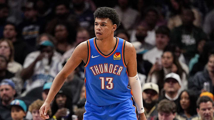Nov 15, 2025; Charlotte, North Carolina, USA; Oklahoma City Thunder forward Ousmane Dieng (13) on defense against the Charlotte Hornets during the second half at Spectrum Center. Mandatory Credit: Jim Dedmon-Imagn Images