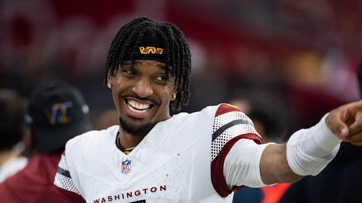 Sep 29, 2024; Glendale, Arizona, USA; Washington Commanders quarterback Jayden Daniels (5) celebrates against the Arizona Cardinals at State Farm Stadium. Mandatory Credit: Mark J. Rebilas-Imagn Images Sep 29, 2024; Glendale, Arizona, USA; Washington Commanders quarterback Jayden Daniels (5) celebrates against the Arizona Cardinals at State Farm Stadium. Mandatory Credit: Mark J. Rebilas-Imagn Images