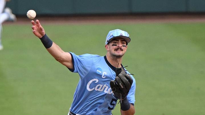 May 30, 2026; Chapel Hill, NC, USA; North Carolina Tar Heels infielder Gavin Gallaher (5) throws to first for a double play during game 4 of the Chapel Hill Regional at Boshamer Stadium. 