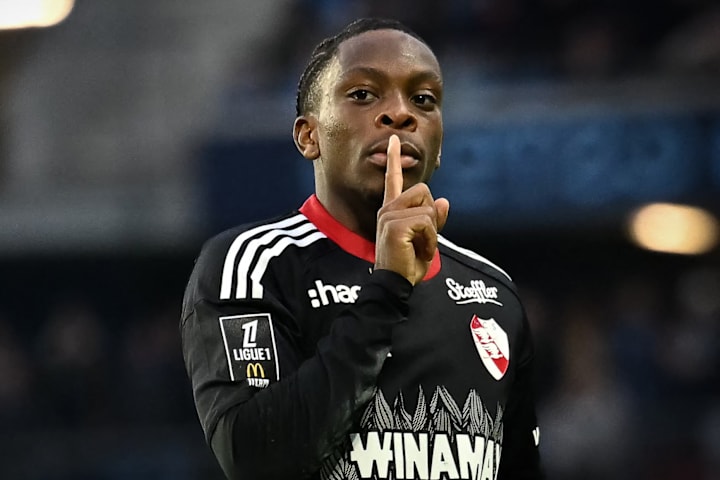 Martial Godo shushing.