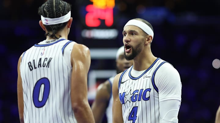 Nov 25, 2025; Philadelphia, Pennsylvania, USA; Orlando Magic guard Anthony Black (0) reacts with guard Jalen Suggs (4) after scoring against the Philadelphia 76ers during the second quarter at Xfinity Mobile Arena. Mandatory Credit: Bill Streicher-Imagn Images