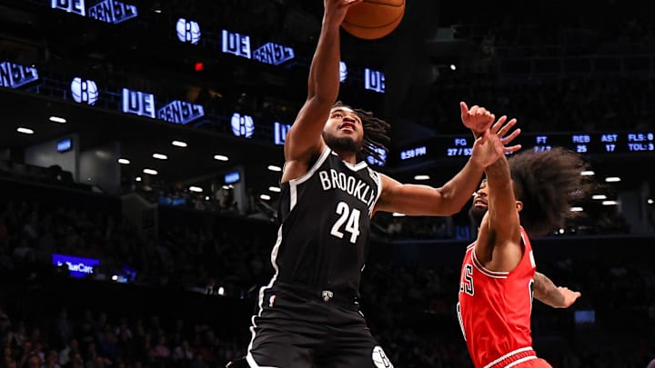 Nov 1, 2024; Brooklyn, New York, USA; Brooklyn Nets guard Cam Thomas (24) shoots the ball as Chicago Bulls guard Coby White (0) defends during the second half at Barclays Center. Mandatory Credit: Vincent Carchietta-Imagn Images