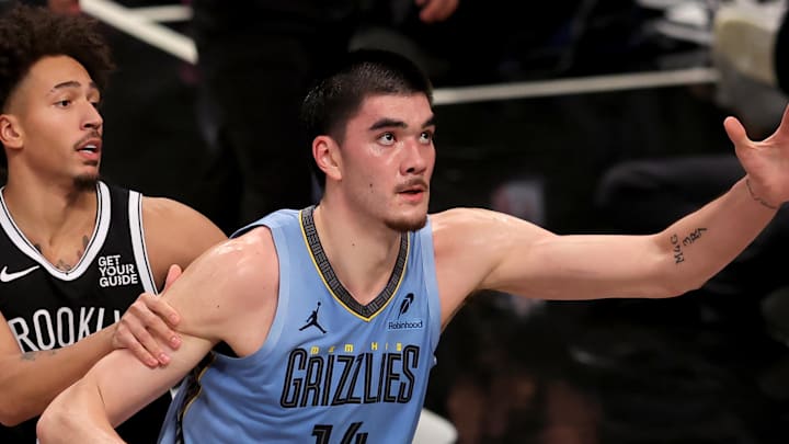 Nov 4, 2024; Brooklyn, New York, USA; Memphis Grizzlies center Zach Edey (14) fights for the ball against Brooklyn Nets forward Jalen Wilson (22) during the third quarter at Barclays Center. Mandatory Credit: Brad Penner-Imagn Images Nov 4, 2024; Brooklyn, New York, USA; Memphis Grizzlies center Zach Edey (14) fights for the ball against Brooklyn Nets forward Jalen Wilson (22) during the third quarter at Barclays Center. Mandatory Credit: Brad Penner-Imagn Images