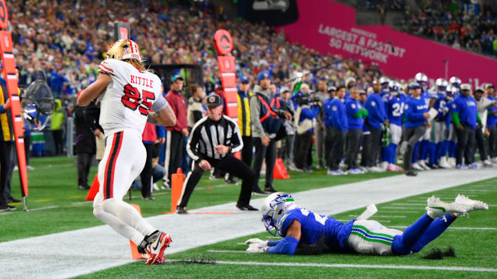 Oct 10, 2024; Seattle, Washington, USA; San Francisco 49ers tight end George Kittle (85) drags his toes for a touchdown against the Seattle Seahawks during the second half at Lumen Field. Mandatory Credit: Steven Bisig-Imagn Images
