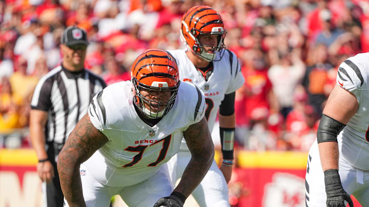 Sep 15, 2024; Kansas City, Missouri, USA; Cincinnati Bengals offensive tackle Trent Brown (77) and guard Alex Cappa (65) on the line of scrimmage against the Kansas City Chiefs during the game at GEHA Field at Arrowhead Stadium. Mandatory Credit: Denny Medley-Imagn Images