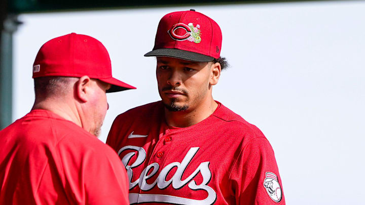 Cincinnati Reds director of pitching Derek Johnson (36) talks with pitcher Chase Burns (26) during a warmup session at the Cincinnati Reds player development complex in Goodyear, Ariz., on Wednesday, Feb. 11, 2026.