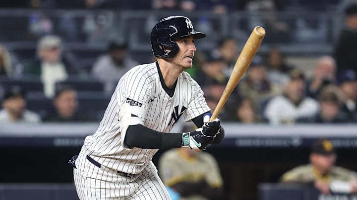 May 6, 2025; Bronx, New York, USA;  New York Yankees left fielder Cody Bellinger (35) hits an RBI single in the seventh inning against the San Diego Padres at Yankee Stadium. 