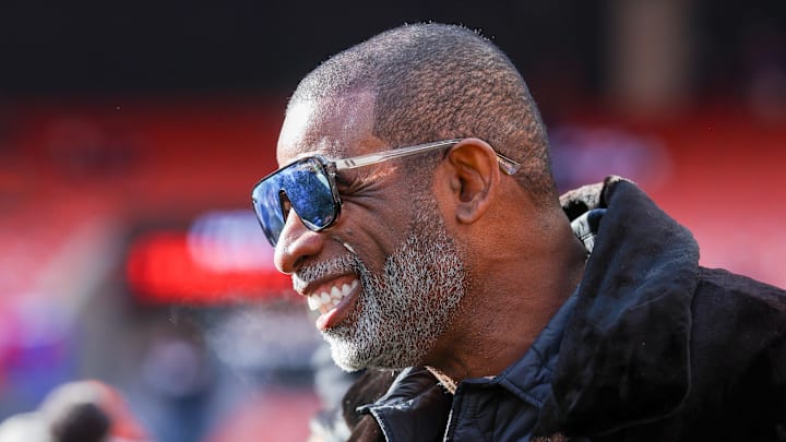 Dec 21, 2025; Cleveland, Ohio, USA;  Legendary  football and baseball player and father of Cleveland Browns quarterback Shedeur Sanders, Deion Sanders on the sidelines prior to a game against the Buffalo Bills at Huntington Bank Field. 
