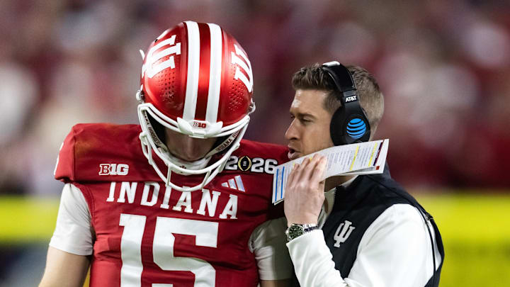 Indiana Hoosiers quarterback Fernando Mendoza (15) with quarterbacks coach Chandler Whitmer against the Miami Hurricanes