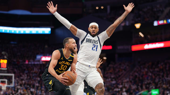 Nov 12, 2024; San Francisco, California, USA; Golden State Warriors guard Stephen Curry (30) is fouled by Dallas Mavericks forward Daniel Gafford (21) in the third quarter at the Chase Center. Mandatory Credit: Cary Edmondson-Imagn Images