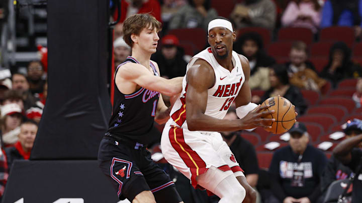 Jan 29, 2026; Chicago, Illinois, USA; Chicago Bulls forward Matas Buzelis (14) defends against Miami Heat center Bam Adebayo (13) during the first half at United Center. Mandatory Credit: Kamil Krzaczynski-Imagn Images