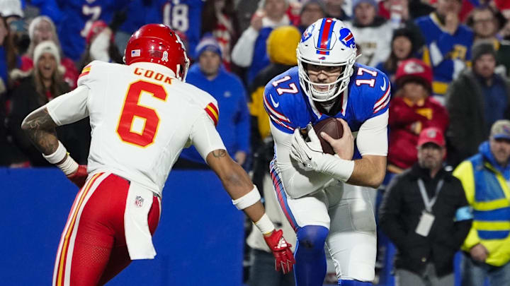 Nov 17, 2024; Orchard Park, New York, USA; Buffalo Bills quarterback Josh Allen (17) runs with the ball for a touchdown against Kansas City Chiefs safety Bryan Cook (6) during the second half at Highmark Stadium. Mandatory Credit: Gregory Fisher-Imagn Images