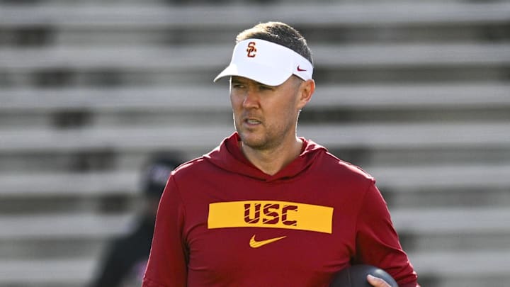 Oct 19, 2024; College Park, Maryland, USA;  Southern California Trojans head coach Lincoln Riley stands on the field before the game against the Maryland Terrapins at SECU Stadium. Mandatory Credit: Tommy Gilligan-Imagn Images