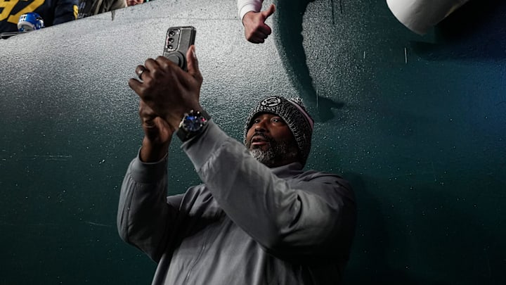 Detroit Lions general manager Brad Holmes takes a selfie with fans ahead of the Philadelphia Eagles game at Lincoln Financial Field in Philadelphia on Sunday, November 16, 2025.