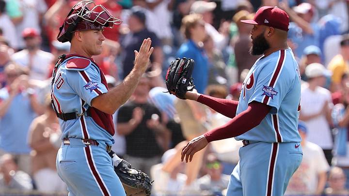 Jun 4, 2026; Philadelphia, Pennsylvania, USA; Philadelphia Phillies catcher J.T. Realmuto (10) and pitcher Jose Alvarado (46) high five after a victory against the San Diego Padres at Citizens Bank Park.