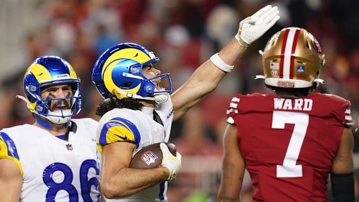 Dec 12, 2024; Santa Clara, California, USA; Los Angeles Rams wide receiver Puka Nacua (17) reacts after making a catch for a first down next to San Francisco 49ers cornerback Charvarius Ward (7) in the fourth quarter at Levi's Stadium. Mandatory Credit: Cary Edmondson-Imagn Images