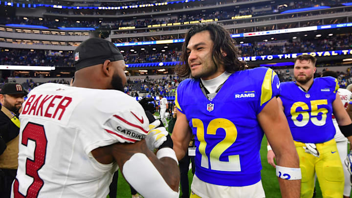 Jan 4, 2026; Inglewood, California, USA;  Los Angeles Rams wide receiver Puka Nacua (12) with Arizona Cardinals safety Budda Baker (3) on the field following a game at SoFi Stadium. Mandatory Credit: Gary A. Vasquez-Imagn Images