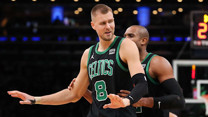 Nov 22, 2023; Boston, Massachusetts, USA; Boston Celtics center Kristaps Porzingis (8) reacts after getting a technical foul during the second half against the Milwaukee Bucks at TD Garden. Mandatory Credit: Paul Rutherford-Imagn Images