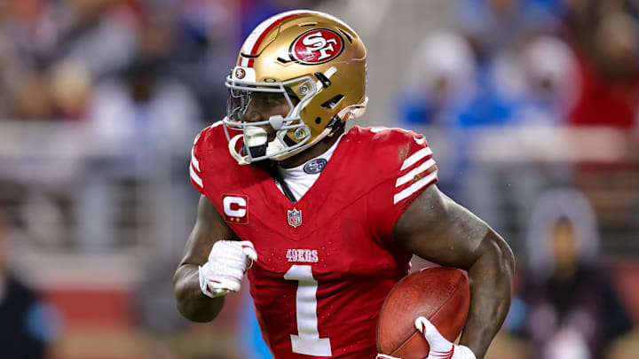 San Francisco 49ers receiver Deebo Samuel runs with the ball.