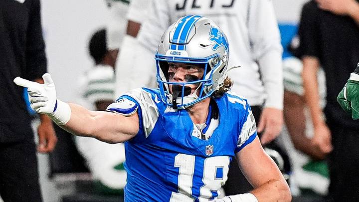 Detroit Lions wide receiver Isaac TeSlaa (18) celebrates a first down against New York Jets linebacker Demario Davis (56) during the first half at Ford Field in Detroit on Sunday, Sept. 27, 2026.