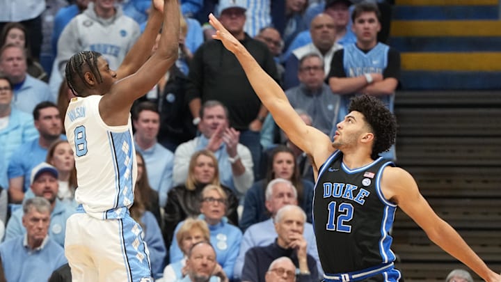 Feb 7, 2026; Chapel Hill, North Carolina, USA; North Carolina Tar Heels forward Caleb Wilson (8) shoots a Duke Blue Devils forward Cameron Boozer (12) defends in the first half at Dean E. Smith Center. Mandatory Credit: Bob Donnan-Imagn Images Feb 7, 2026; Chapel Hill, North Carolina, USA; North Carolina Tar Heels forward Caleb Wilson (8) shoots a Duke Blue Devils forward Cameron Boozer (12) defends in the first half at Dean E. Smith Center. Mandatory Credit: Bob Donnan-Imagn Images