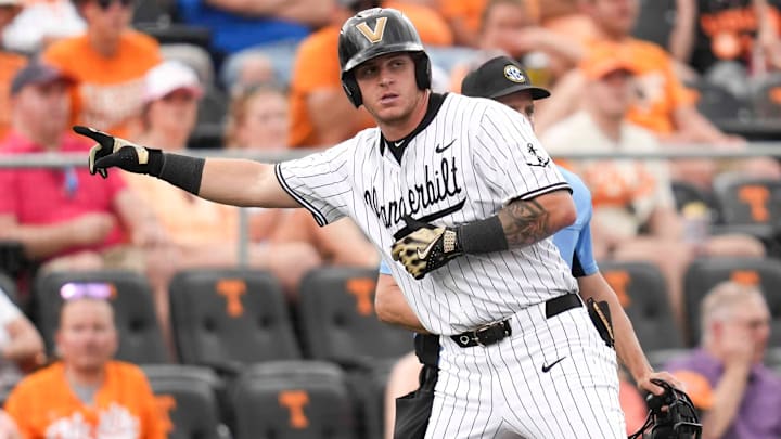 Vanderbilt infielder Braden Holcomb (26) gestures to the Vanderbilt dugout after hitting a triple during a NCAA baseball game between the Tennessee Volunteers and Vanderbilt Commodores at Lindsey Nelson Stadium on May 11, 2025. Vanderbilt infielder Braden Holcomb (26) gestures to the Vanderbilt dugout after hitting a triple during a NCAA baseball game between the Tennessee Volunteers and Vanderbilt Commodores at Lindsey Nelson Stadium on May 11, 2025.