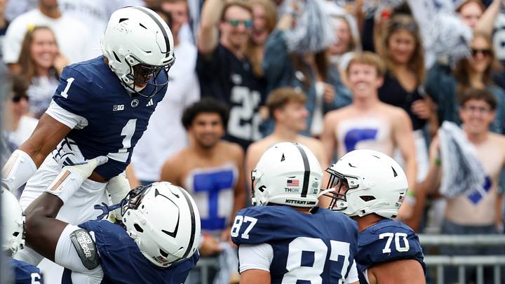 Penn State Nittany Lions running back James Peoples (1) celebrates with offensive linesman Anthony Donkoh (68) 