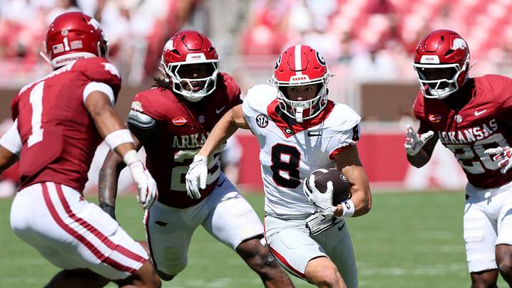 Georgia Bulldogs wide receiver Landon Roldan (8) runs with the ball against the Arkansas Razorbacks during the second half at Razorback Stadium. 