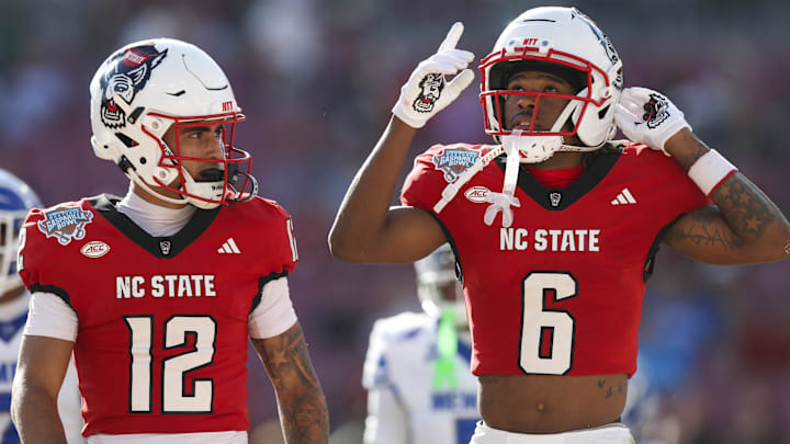 Dec 19, 2025; Tampa, FL, USA; NC State Wolfpack wide receiver Wesley Grimes (6) reacts after scoring a touchdown against the Memphis Tigers in the first quarter during the Gasparilla Bowl at Raymond James Stadium. Mandatory Credit: Nathan Ray Seebeck-Imagn Images