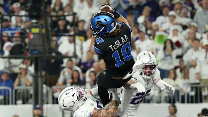 Detroit Lions wide receiver Isaac Teslaa (18) makes a catch for a touchdown defended by Minnesota Vikings linebacker Blake Cashman (51) and safety Harrison Smith (22) in the second quarter at U.S. Bank Stadium.