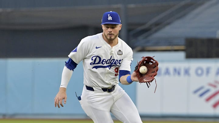 Oct 25, 2024; Los Angeles, California, USA; Los Angeles Dodgers second baseman Gavin Lux (9) fields a ball in the second inning against the New York Yankees during game one of the 2024 MLB World Series at Dodger Stadium. Mandatory Credit: Jayne Kamin-Oncea-Imagn Images Oct 25, 2024; Los Angeles, California, USA; Los Angeles Dodgers second baseman Gavin Lux (9) fields a ball in the second inning against the New York Yankees during game one of the 2024 MLB World Series at Dodger Stadium. Mandatory Credit: Jayne Kamin-Oncea-Imagn Images