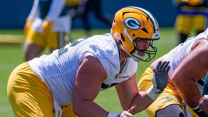 Green Bay Packers offensive lineman Jager Burton (52) runs through a drill during practice