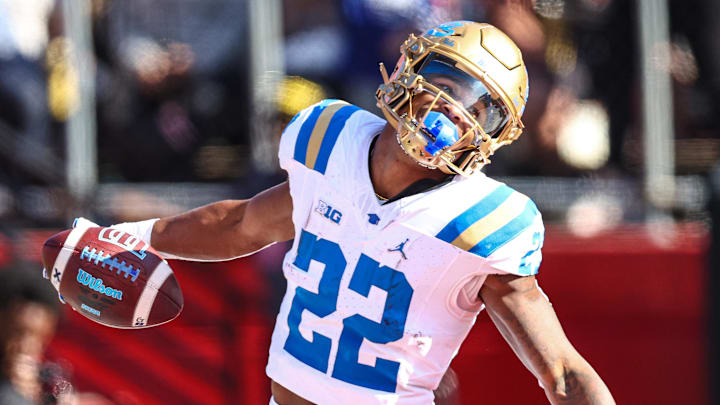 Oct 19, 2024; Piscataway, New Jersey, USA; UCLA Bruins running back Keegan Jones (22) scores a receiving touchdown during the second half against the Rutgers Scarlet Knights at SHI Stadium. Mandatory Credit: Vincent Carchietta-Imagn Images