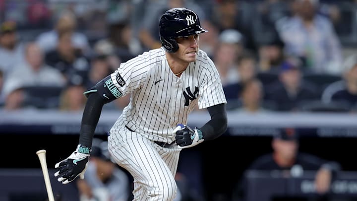 Sep 11, 2025; Bronx, New York, USA; New York Yankees center fielder Cody Bellinger (35) follows through on an RBI single against the Detroit Tigers during the fourth inning at Yankee Stadium. Mandatory Credit: Brad Penner-Imagn Images