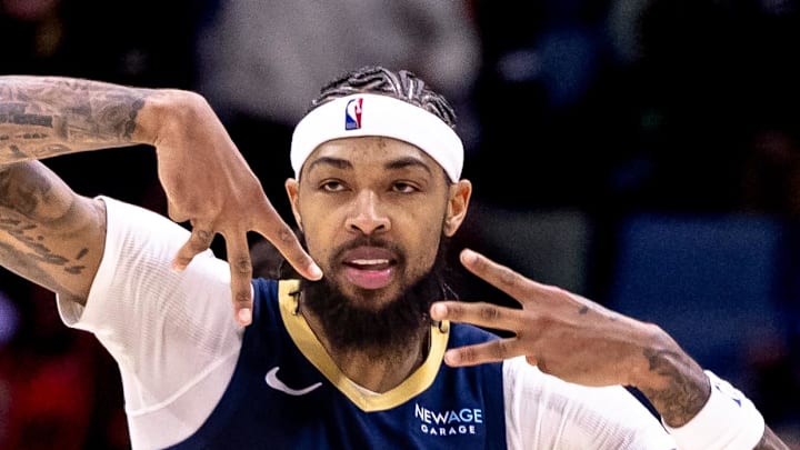 Dec 5, 2024; New Orleans, Louisiana, USA;  New Orleans Pelicans forward Brandon Ingram (14) reacts to making a three point basket against the Phoenix Suns during the first half  at Smoothie King Center. Mandatory Credit: Stephen Lew-Imagn Images