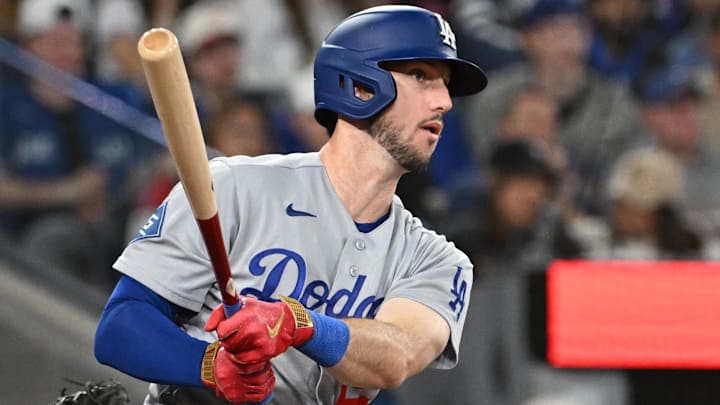 Apr 7, 2026; Toronto, Ontario, CAN; Los Angeles Dodgers right fielder Kyle Tucker (23) hits an RBI double against the Toronto Blue Jays in the ninth inning at Rogers Centre. Mandatory Credit: Dan Hamilton-Imagn Images